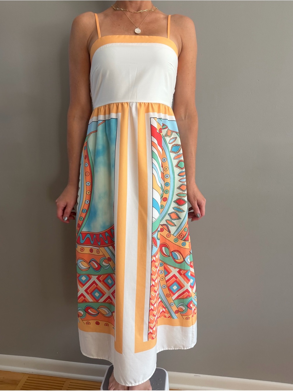 Sleeveless White & Orange Printed Maxi Dress